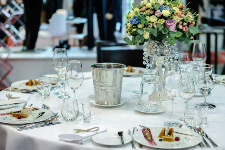 Elegant private dining table setting with floral centerpiece