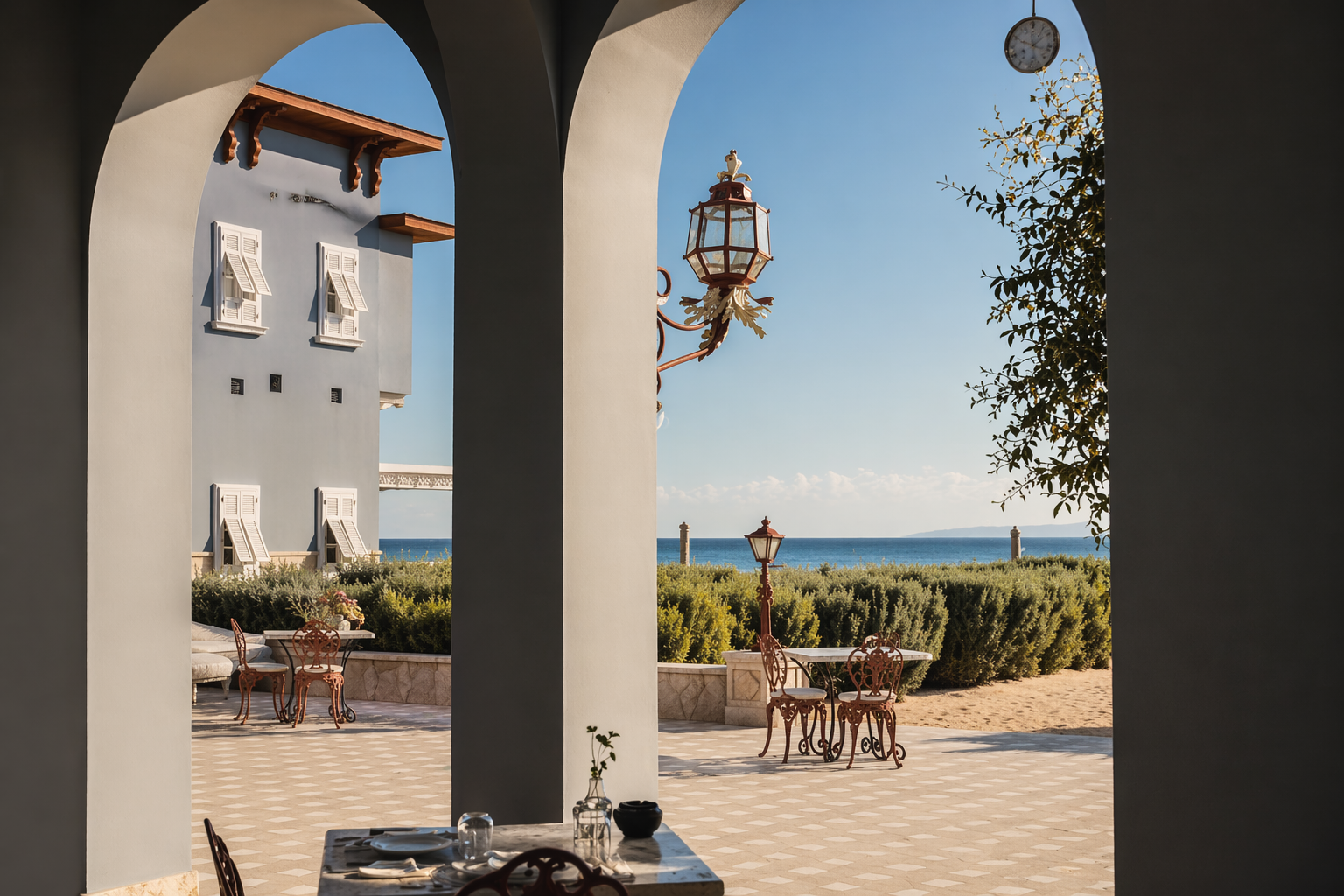 Coastal courtyard under sunlit arches
